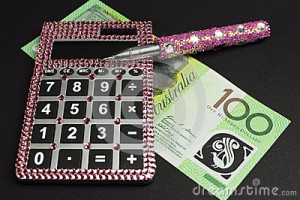 savings-money-management-concept-calculator-australian-hundred-dollar-note-pink-against-black-background-33272644